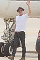 brad pitt waves goodbye before hopping on a private plane 01