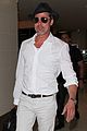 brad pitt wears all white for his lax arrival 06