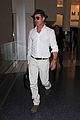 brad pitt wears all white for his lax arrival 19