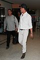 brad pitt wears all white for his lax arrival 21
