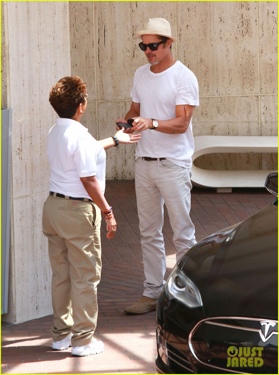brad pitt sports an arm bandage while shopping with maddox 043720619