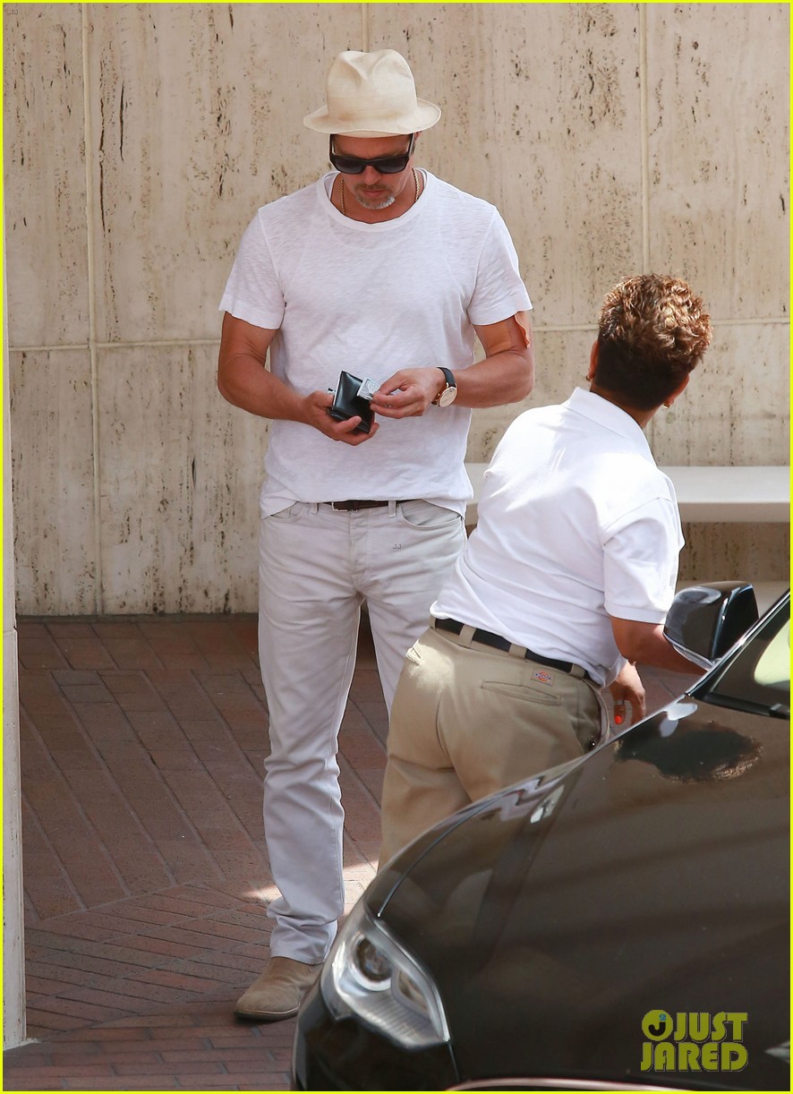 brad pitt sports an arm bandage while shopping with maddox 073720622