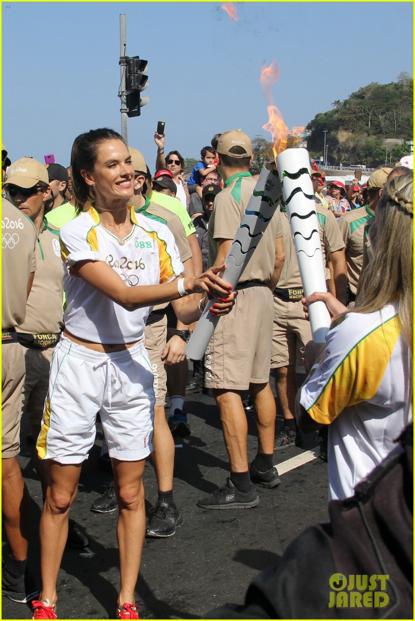 Alessandra Ambrosio & Adriana Lima Carry the Olympic Torch! Photo