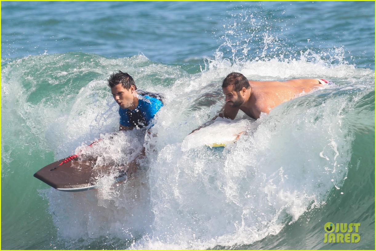 taylor lautner spends sunday catching waves 263739297