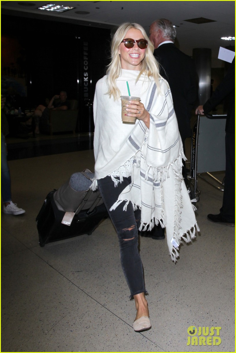 julianne hough grabs an iced coffee after arriving at lax airport 093753210