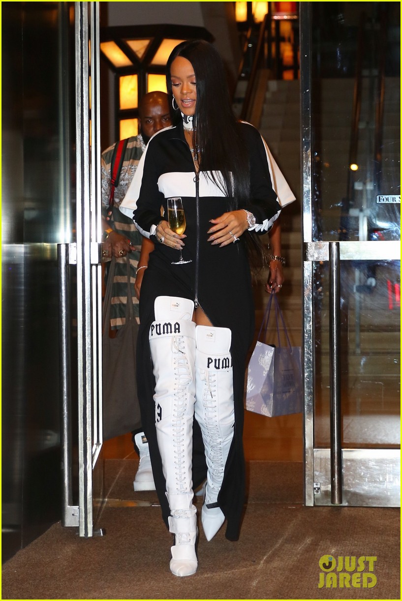 rihanna leaves her pop up shop with champagne in hand 143751024