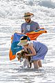 seth rogen and wife lauren miller take their dog for a dip in the ocean 01