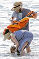 seth rogen and wife lauren miller take their dog for a dip in the ocean 03