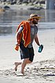 seth rogen and wife lauren miller take their dog for a dip in the ocean 06