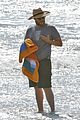 seth rogen and wife lauren miller take their dog for a dip in the ocean 08