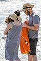 seth rogen and wife lauren miller take their dog for a dip in the ocean 11