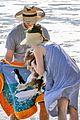 seth rogen and wife lauren miller take their dog for a dip in the ocean 13