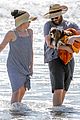 seth rogen and wife lauren miller take their dog for a dip in the ocean 19