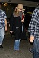 jennifer aniston covers up while arriving back in la 04