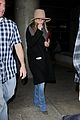 jennifer aniston covers up while arriving back in la 08