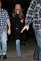 jennifer aniston covers up while arriving back in la 09