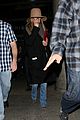 jennifer aniston covers up while arriving back in la 10
