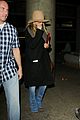 jennifer aniston covers up while arriving back in la 11