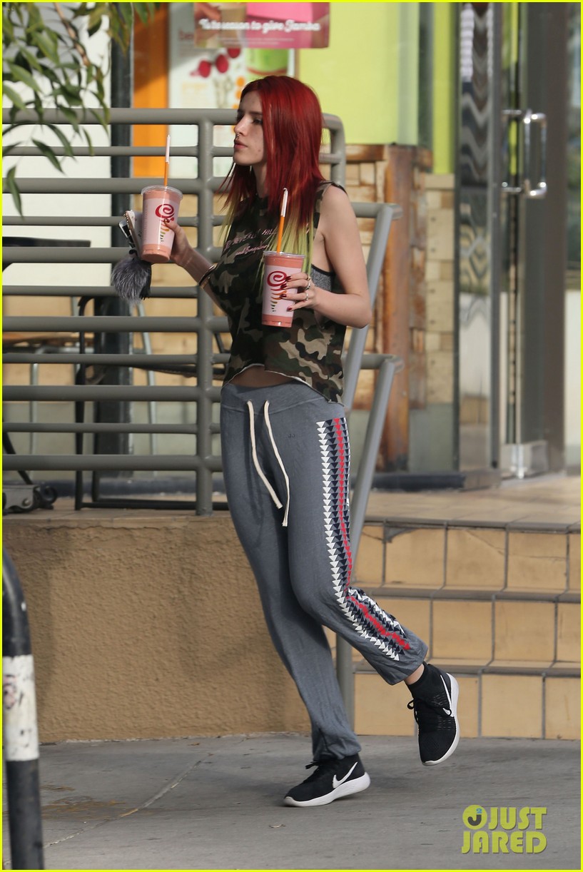 bella thorne shows off new bright red and yellow hair color at the gym 183809510