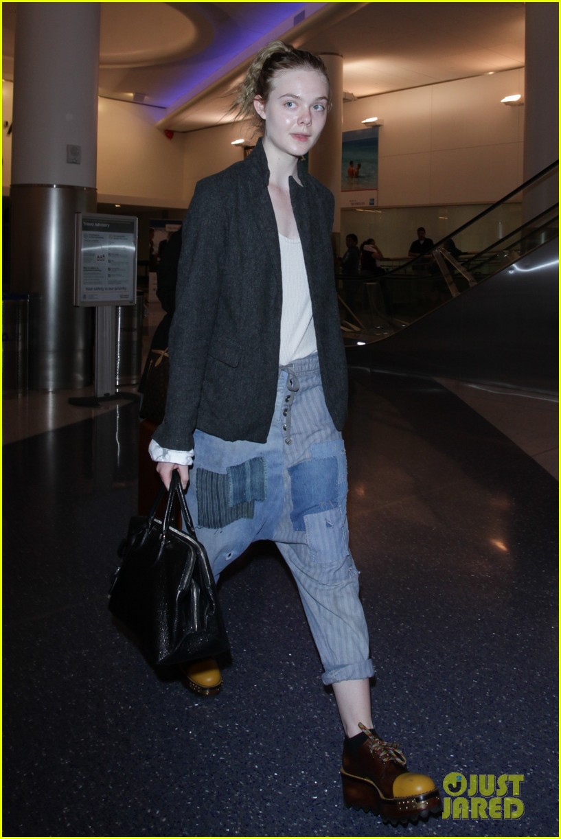 elle fanning super busy new film lax arrival pics 01