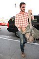 newly single gerard butler catches a solo flight out of lax 07