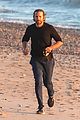dad to be bradley cooper goes for a run on the beach 01