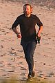 dad to be bradley cooper goes for a run on the beach 07