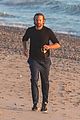 dad to be bradley cooper goes for a run on the beach 11