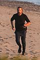 dad to be bradley cooper goes for a run on the beach 19