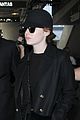 emma stone keeps a low profile while arriving at lax 01