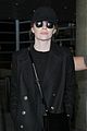 emma stone keeps a low profile while arriving at lax 03