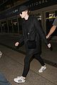 emma stone keeps a low profile while arriving at lax 04