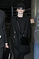 emma stone keeps a low profile while arriving at lax 09