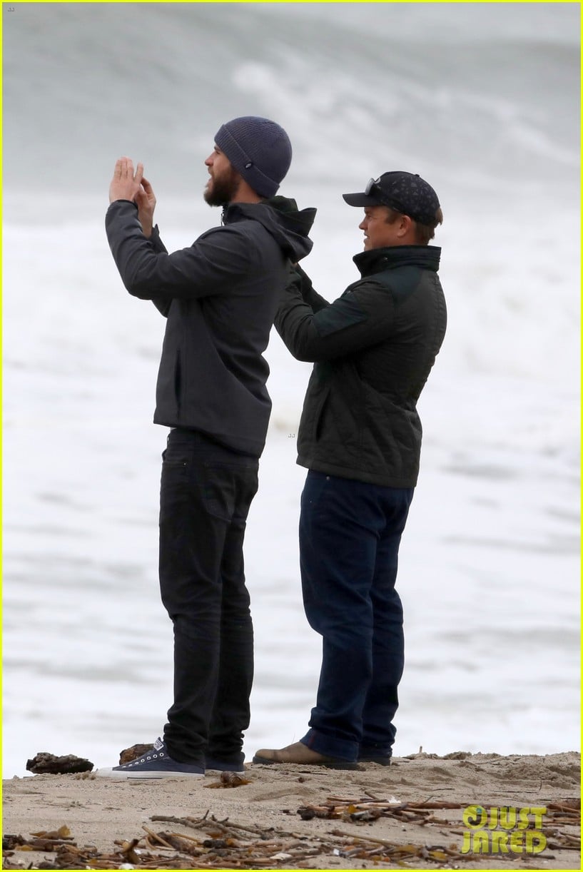 liam hemsworth and brother luke check out surf after socal storm 023862422
