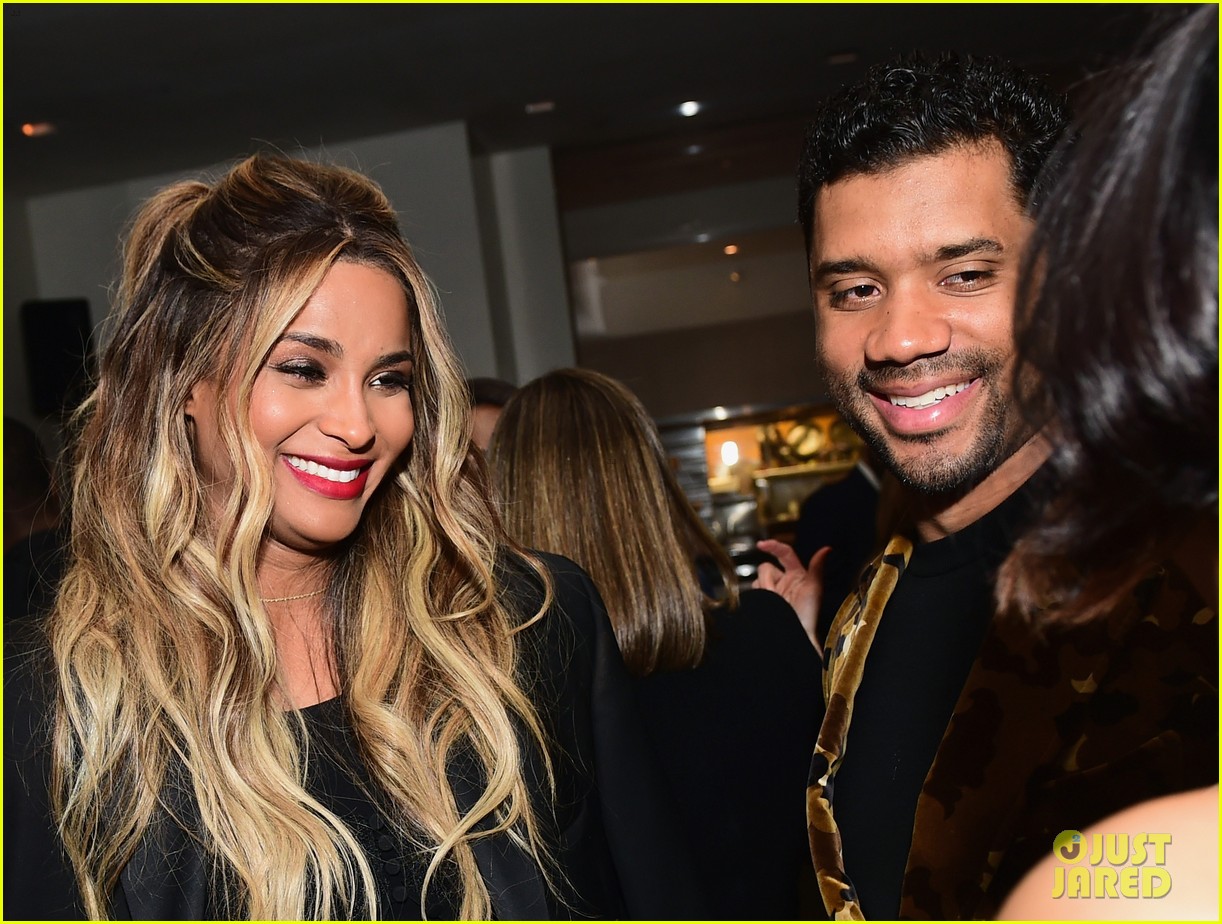 Russell Wilson Holds Pregnant Ciara's Baby Bump at Oscars Party! Photo