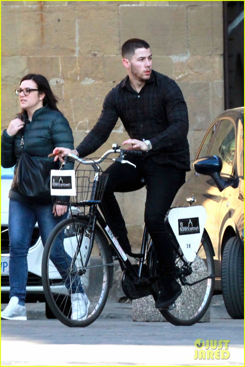nick jonas defines dapper while drinking champagne on a boat in his turtleneck 043875580