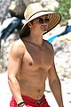 orlando bloom goes shirtless at the beach for memorial day weekend 04