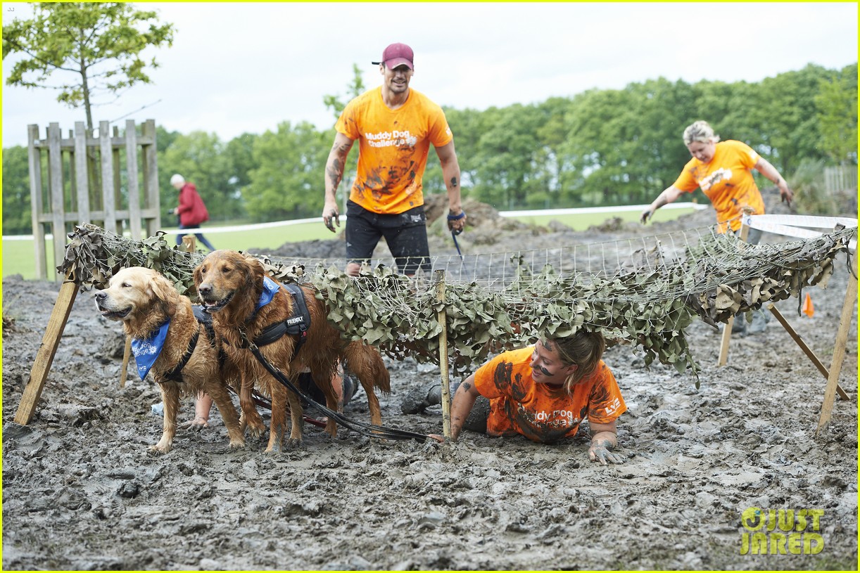 david gandy gets down dirty in the mud with his pup053902446
