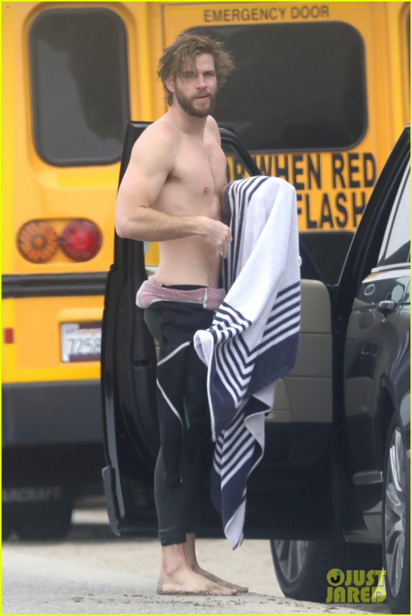 liam hemsworth strips out of wetsuit to reveal ripped abs 243917142