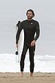 liam hemsworth strips out of wetsuit to reveal ripped abs 19