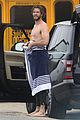 liam hemsworth strips out of wetsuit to reveal ripped abs 55