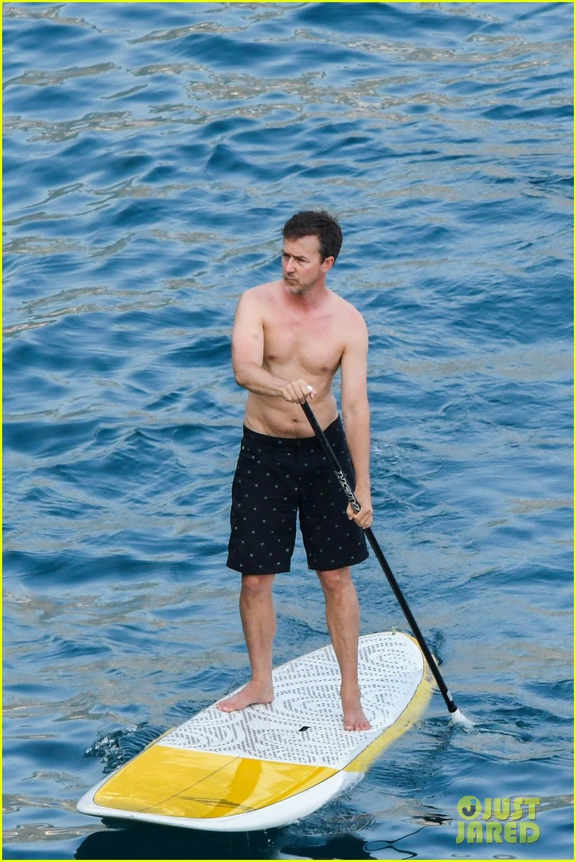 edward norton goes shirtless for paddle boarding in italy 01
