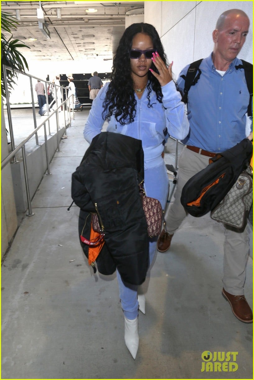 rihanna is pretty in purple velour tracksuit at lax airport 04