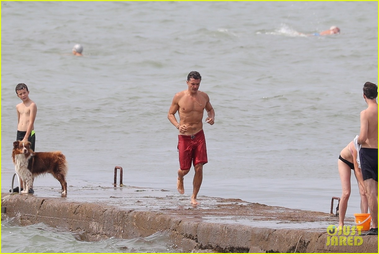 orlando bloom goes shirtless in low riding trunks at the beach 11