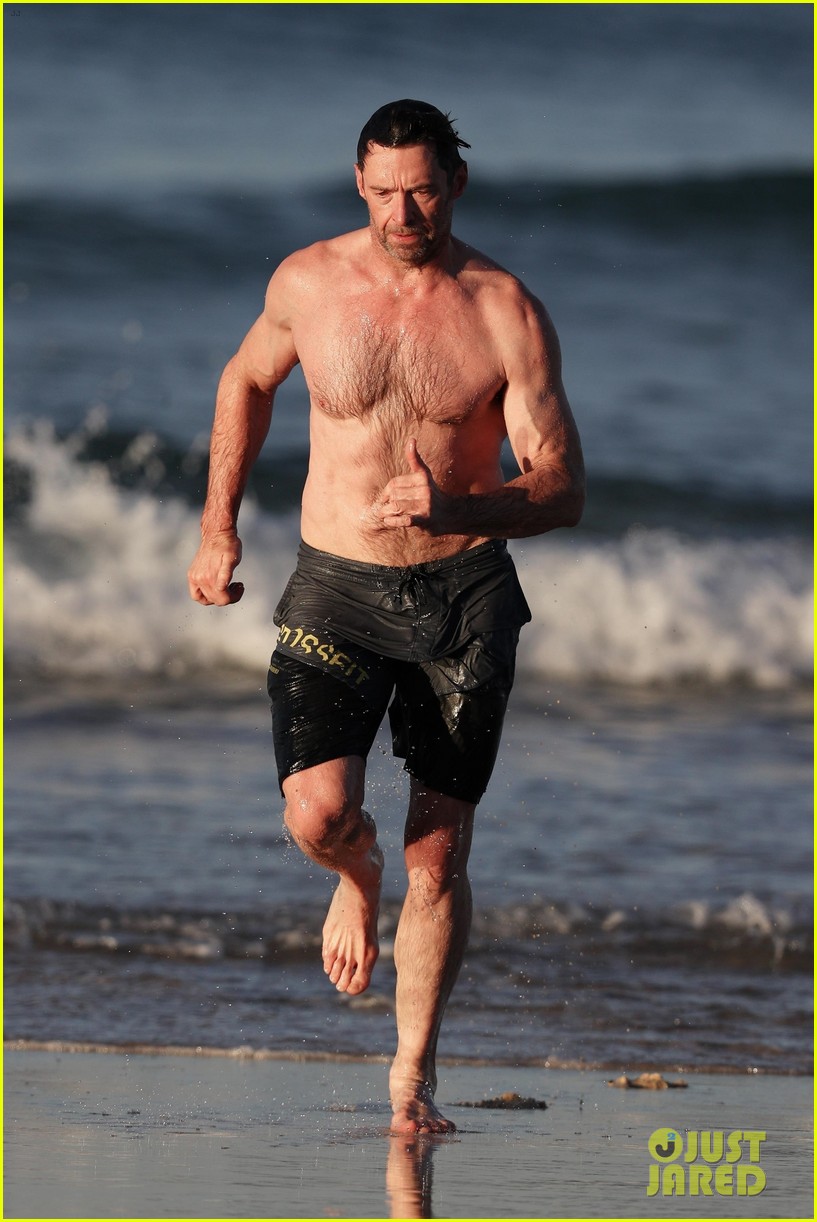 hugh jackman runs shirtless on the beach with his ripped muscles 263935942