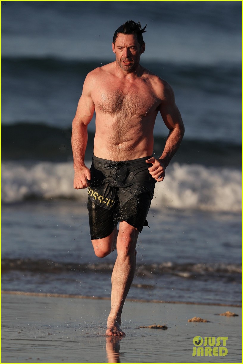 hugh jackman runs shirtless on the beach with his ripped muscles 30