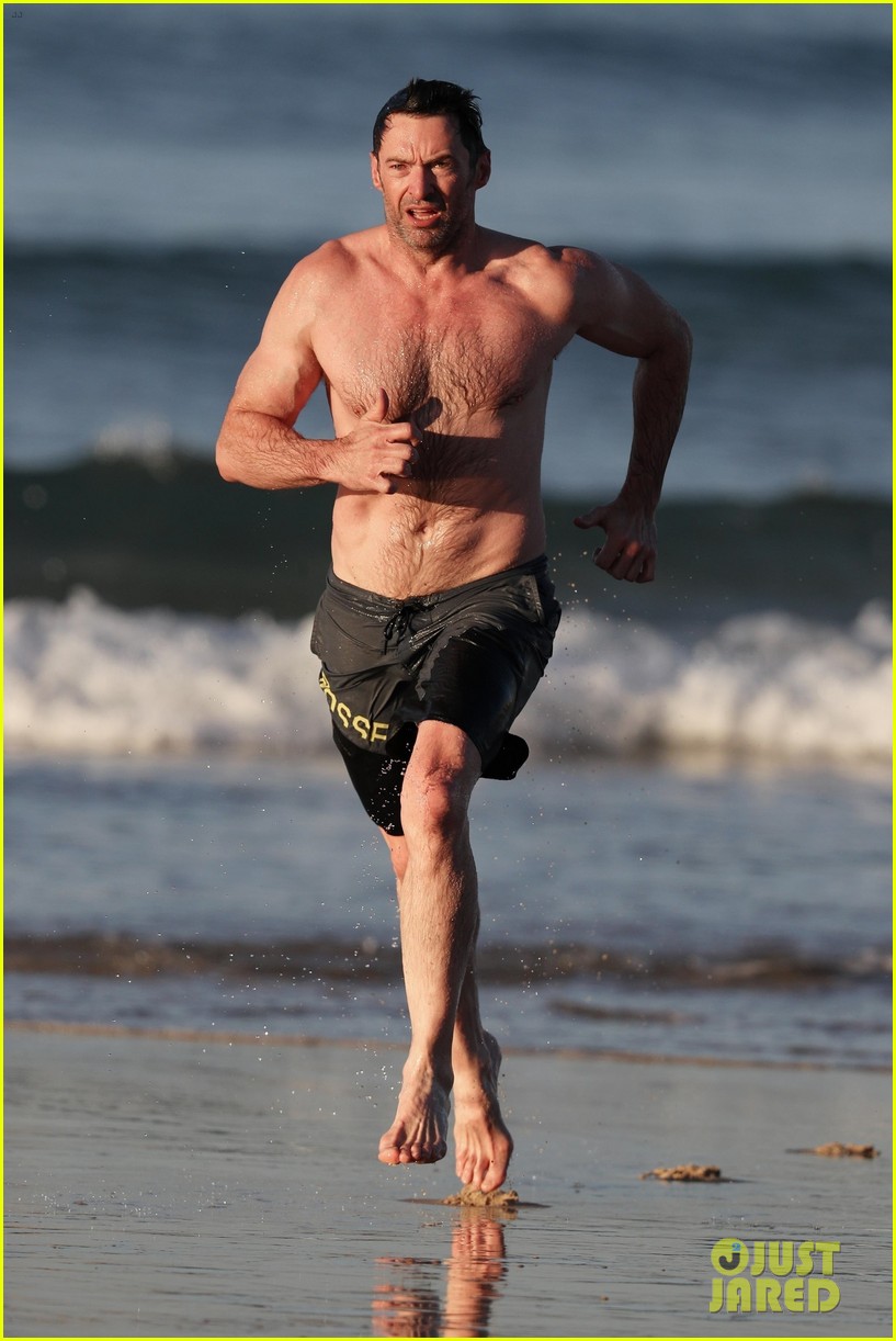 hugh jackman runs shirtless on the beach with his ripped muscles 343935950
