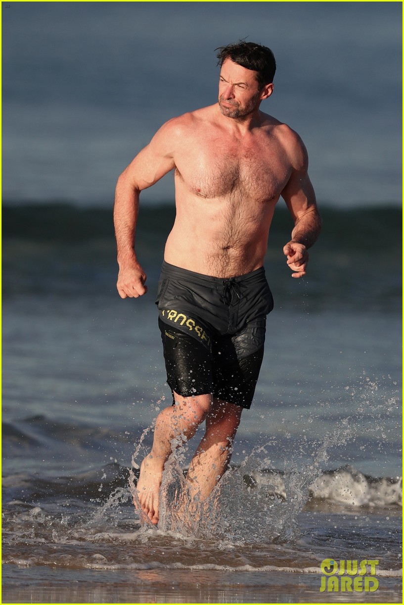 hugh jackman runs shirtless on the beach with his ripped muscles 49