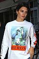 kendall jenner brightens up outfit with orange bag 03