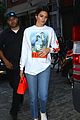 kendall jenner brightens up outfit with orange bag 04